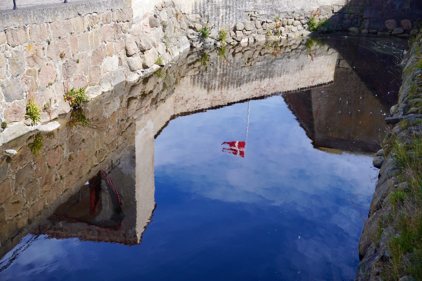 The Danish flag reflected in Kronborg's moat